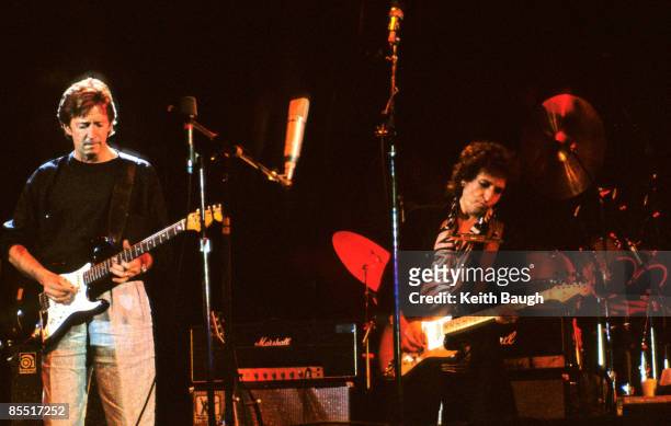 Photo of Bob DYLAN and Eric CLAPTON, Eric Clapton and Bob Dylan performing on stage