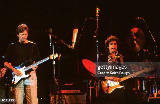 Photo of Bob DYLAN and Eric CLAPTON, Eric Clapton and Bob Dylan performing on stage