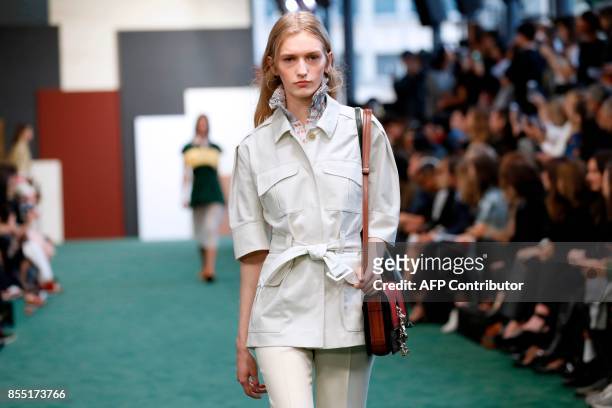 Model presents a creation by Carven during the women's 2018 Spring/Summer ready-to-wear collection fashion show in Paris, on September 28, 2017. /...