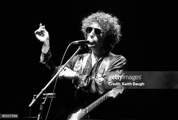 Photo of Bob DYLAN, Bob Dylan performing on stage, sunglasses