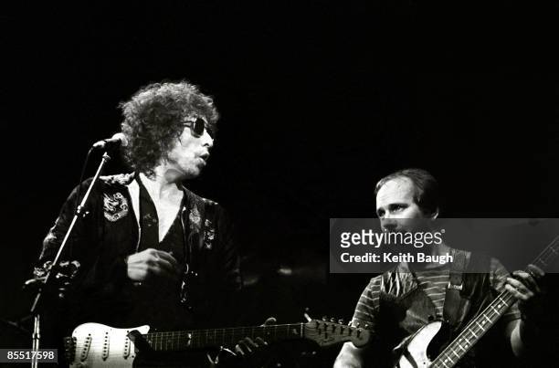 Photo of Bob DYLAN and Tim DRUMMOND, Bob Dylan and Tim Drummond performing on stage, sunglasses