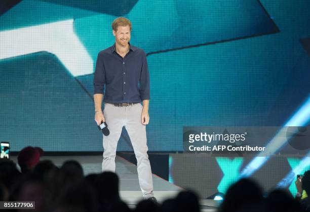 Britain's Prince Harry speaks at the We Day event in Toronto, Ontario, September 28, 2017. / AFP PHOTO / Geoff Robins