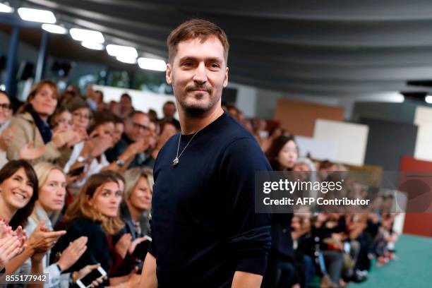 Fashion designer for Carven, Serge Ruffieux, ackowledge the audience at the end of his women's 2018 Spring/Summer ready-to-wear collection fashion...