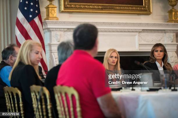 First Lady Melania Trump attends a listening session regarding the opioid crisis in the State Dining Room of the White House, September 28, 2017 in...