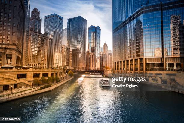 city buildings and skyline over the chicago river illinois usa - michigan avenue stock pictures, royalty-free photos & images