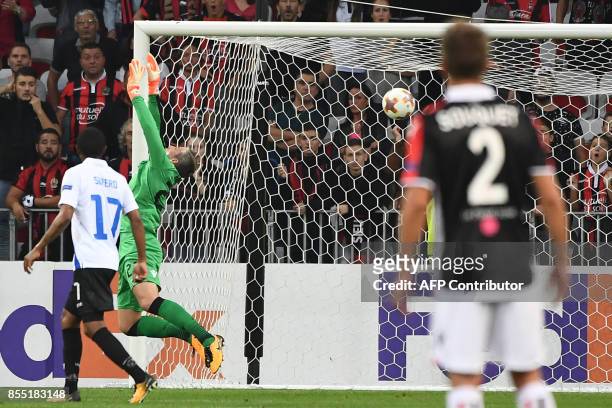 Vitesse's Dutch goalkeeper Remko Pasveer attempts to block Nice's French forward Alassane Plea goal during the UEFA Europa League group K football...