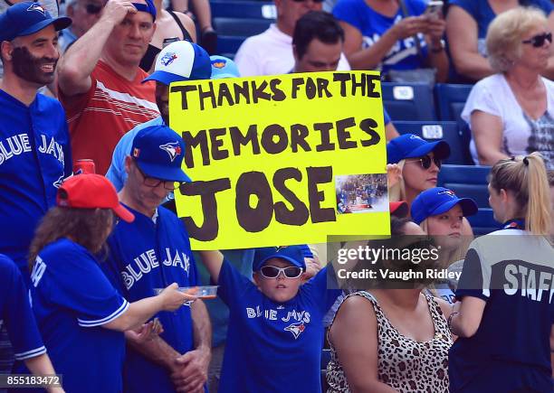 Fans show their appreciation with a sign for Jose Bautista of the Toronto Blue Jays during MLB game action against the New York Yankees at Rogers...