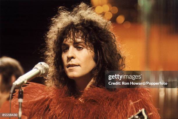 Singer and guitarist Marc Bolan of English rock band T. Rex performs on the set of a pop music television show in London circa 1972.