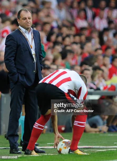 Zorya Louhansk's coach from Ukraine Iurii Vernydub stands on the sideline during the Europa League football match Athletic Club Bilbao vs FC Zorya...