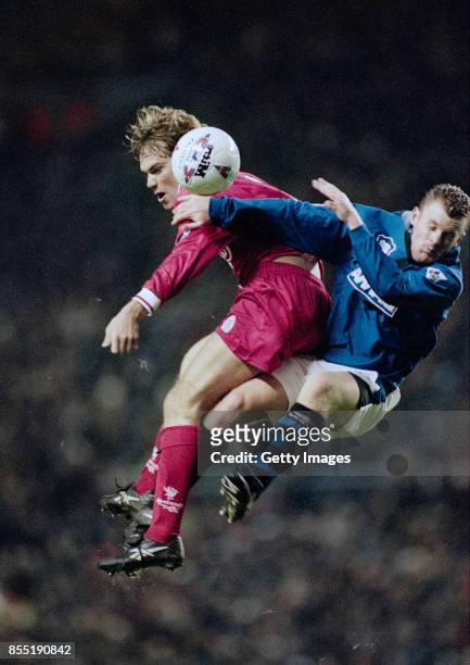 Jason McAteer challenges Graham Stuart of Everton during a Premier League match at Anfield on November 19, 1996 in Liverpool, England.