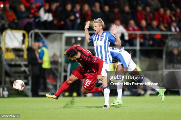 Saman Ghoddos of Ostersunds FK and Per Chiljan Skjelbred of Herta Berlin SC competes for the ball during the UEFA Europa League group J match between...