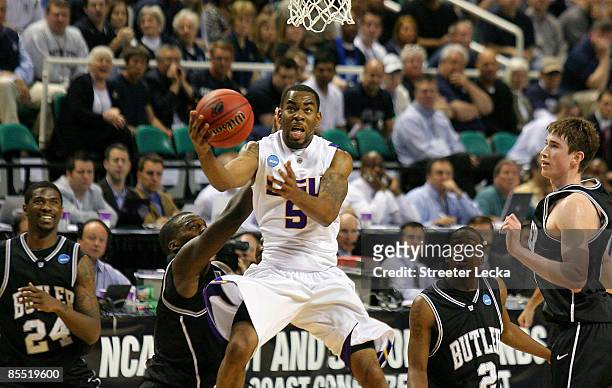 Marcus Thornton of the Louisiana State University Tigers drives through the defense of the Butler Bulldogs during the first round of the NCAA...