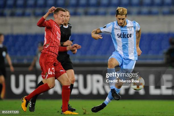 Luis Alberto of SS Lazio compete for the ball with Sander Coopman of SV Zulte Waregem during the UEFA Europa League group K match between SS Lazio...