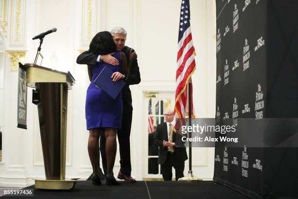 Supreme Court Justice Neal Gorsuch hugs Mary Elizabeth Taylor, a TFAS program alumnus of 2010 who introduces him during an event hosted by The Fund...