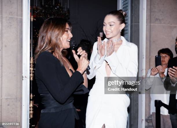 In this handout provided by Messika, Valerie Messika and Gigi Hadid attend the Messika cocktail as part of the Paris Fashion Week Womenswear...