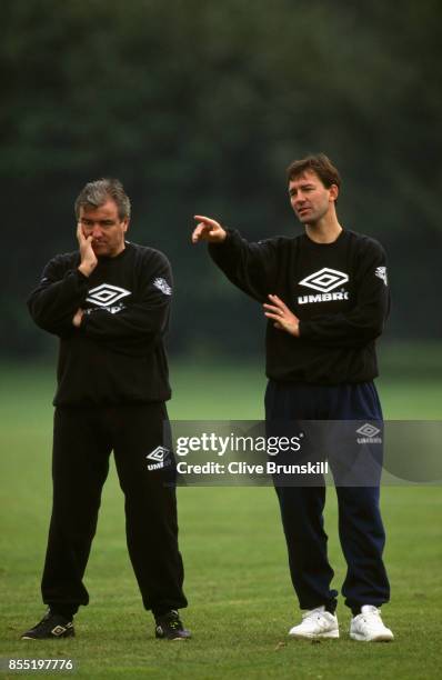 England manager Terry Venables looks on as Bryan Robson makes a point during an England training session at Bisham Abbey on October 11, 1994 in...