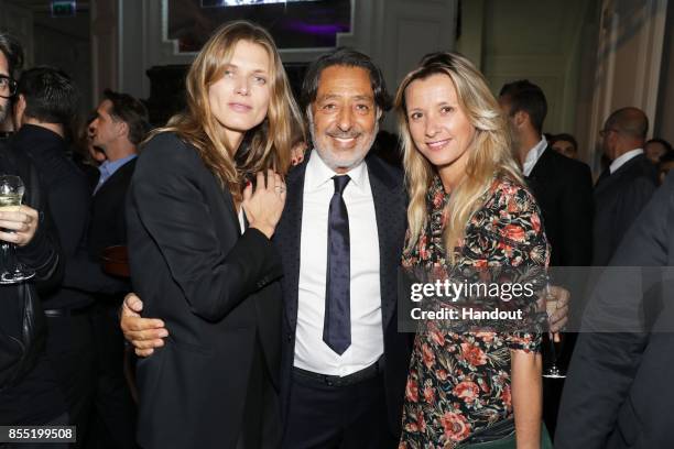 In this handout provided by Messika, Malgosia Bela, Andre Messika and Sarah Lavoine attend the Messika cocktail as part of the Paris Fashion Week...