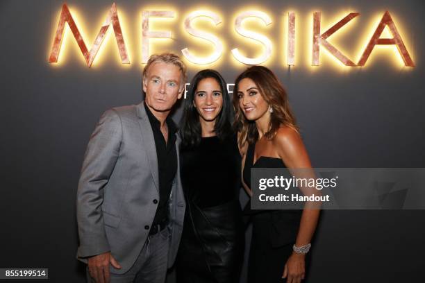 In this handout provided by Messika, Franck Dubosc, Daniele Dubosc and Valerie Messika attend the Messika cocktail as part of the Paris Fashion Week...