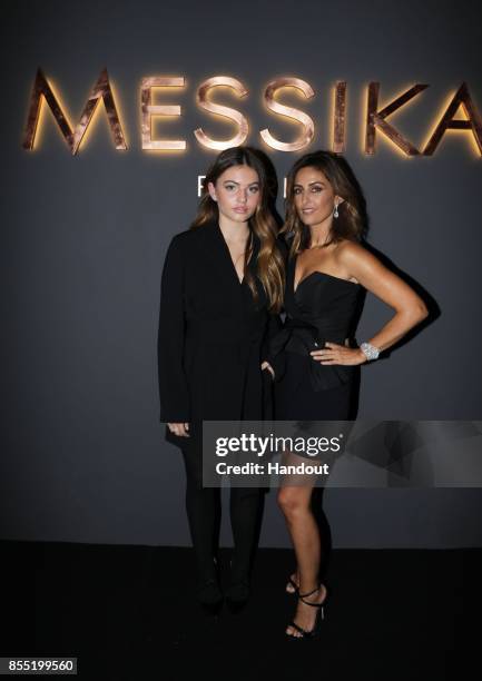 In this handout provided by Messika, Thylane Blondeau and Valerie Messika attend the Messika cocktail as part of the Paris Fashion Week Womenswear...