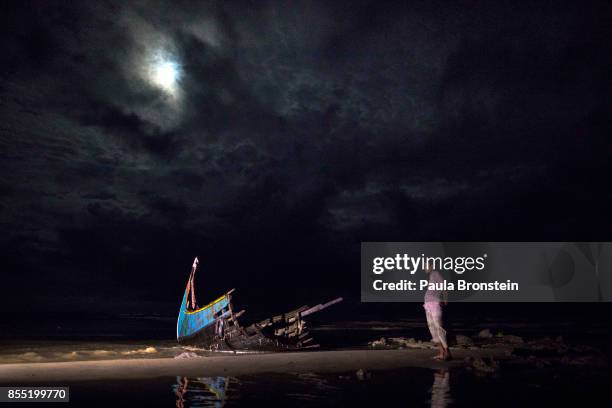 Destroyed boat is seen on a beach washed up after it sunk in rough seas off the coast of Bangladesh carrying over 100 people September 28 close to...