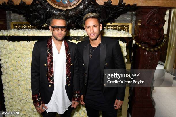 Daniel Alves and Neymar attend the Balmain show as part of the Paris Fashion Week Womenswear Spring/Summer 2018 on September 28, 2017 in Paris,...
