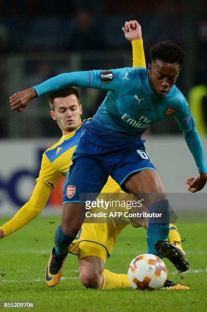 Borisov's midfielder from Montenegro Mirko Ivanic and Arsenal's forward from England Joe Willock vie for the ball during the UEFA Europa League Group...