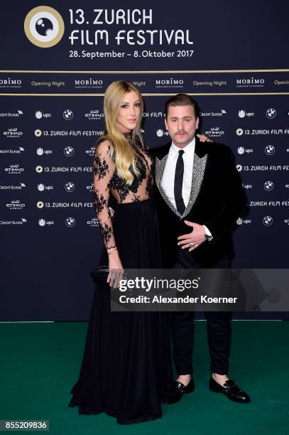 Singer Baschi and girlfriend Alana Netzer attend the opening ceremony and 'Borg vs. McEnroe' premiere at the 13th Zurich Film Festival on September...