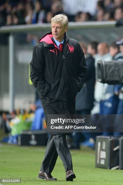 Arsenal's coach from France Arsene Wenger walks during the UEFA Europa League Group H football match between FC BATE Borisov and Arsenal FC in...