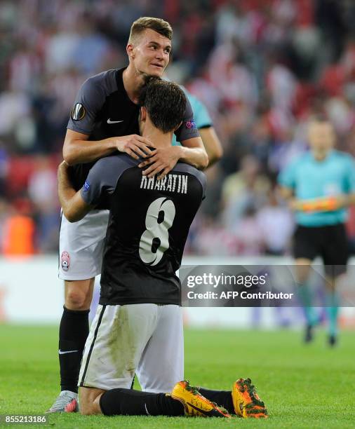 Zorya Louhansk's midfielder from Ukraine Vladyslav Kochergin and midfielder from Ukraine Ihor Kharatin celebrate celebrate at the end of the Europa...