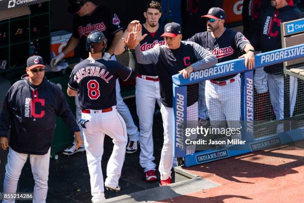 Manager Terry Francona and bench coach Brad Mills celebrate with Lonnie Chisenhall of the Cleveland Indians after Chisenhall scored during the fifth...