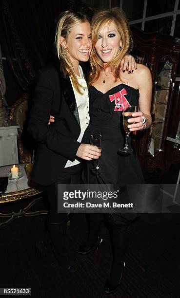 Kelly Hoppen and Sienna Miller attend the party to celebrate Hoppen's MBE received for her services to interior design, at Beach Blanket Babylon on...
