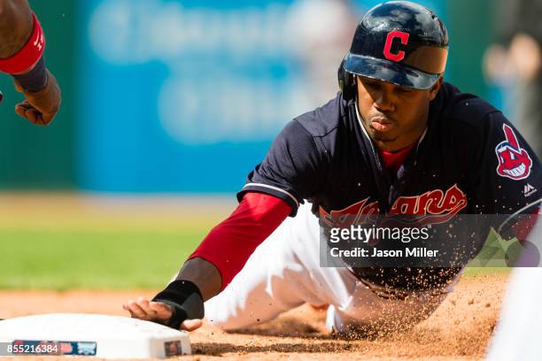 Greg Allen of the Cleveland Indians dives back to first base during the seventh inning against the Minnesota Twins at Progressive Field on September...