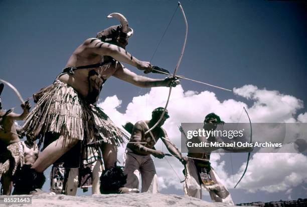 S: Members of the Shivwitz Paiute tribe show off their prowess with a bow and arrow during the Inter-Tribal Indian Ceremonial circa late 1940's in...