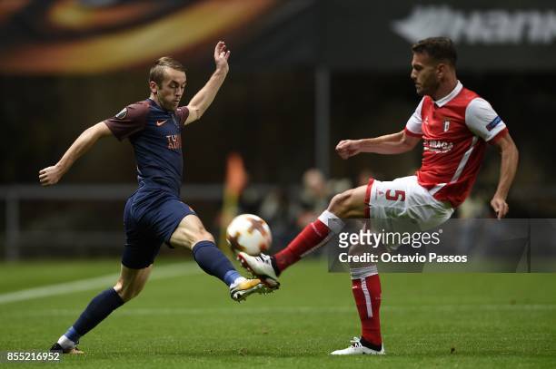 Nuno Sequeira of Sporting Braga competes for the ball with Edin Visca of Basaksehir F.K. During the UEFA Europa League group C match between Sporting...