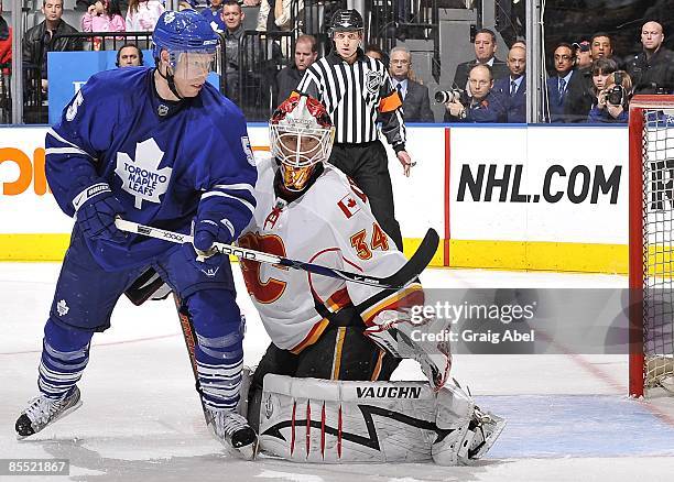 Jason Blake of the Toronto Maple Leafs skates in front of Miikka Kiprusoff of the Calgary Flames during game action March 14, 2009 at the Air Canada...