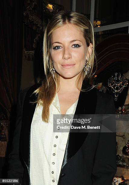 Sienna Miller attends the party to celebrate Kelly Hoppen's MBE received for her services to interior design, at Beach Blanket Babylon on March 19,...