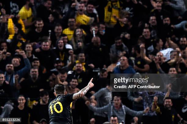 Aek's Croatian forward Marko Livaja celebrates with supporters after scoring a goal during the UEFA Europa League Group D football match between AEK...