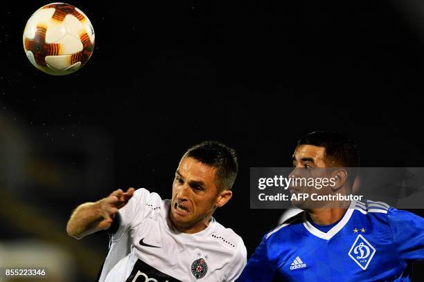 Partizan's defender Miroslav Vulicevic fights for the ball with Dynamo Kyiv's midfielder Derlis Gonzalez during the UEFA Europa League match between...