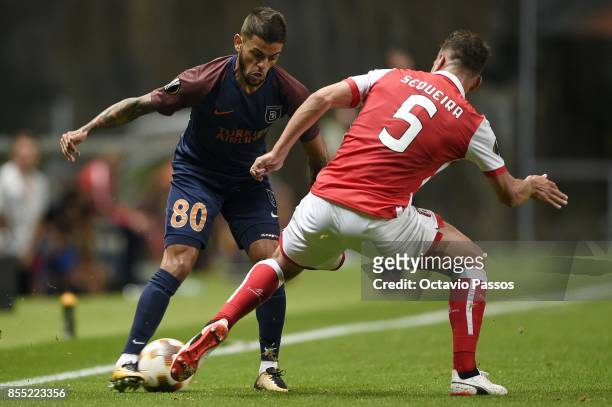 Nuno Sequeira of Sporting Braga competes for the ball with Junior Caicara of Basaksehir F.K. During the UEFA Europa League group C match between...