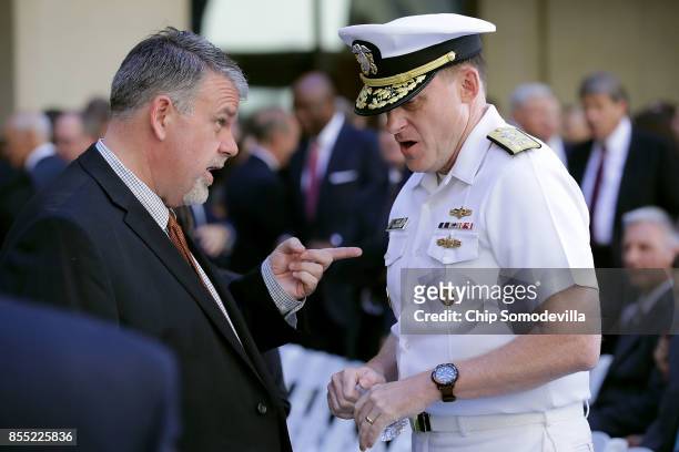 National Counterterrorism Center Director Nicholas Rasmussen talks with National Security Agency Director Admiral Michael Rogers before the...