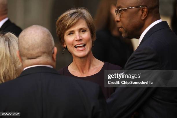 Former Deputy Attorney General Sally Yates visits before the installation ceremony for Federal Bureau of Investigatoin Director Christopher Wray at...