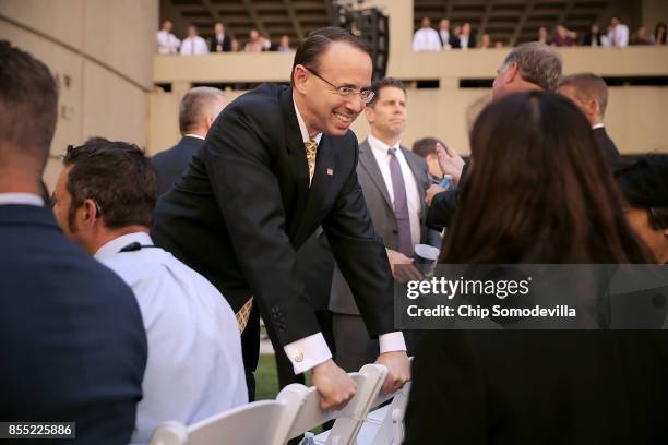 Deputy Attorney General Rod Rosenstein visits before the installation of Federal Bureau of Investigation Director Christopher Wray at FBI headquaters...