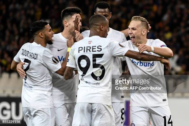 Austria Wien's forward Christoph Monschein celebrates with teammates after scoring a goal during the UEFA Europa League Group D football match...