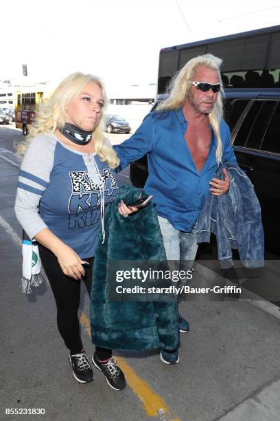 Dog the Bounty Hunter and Beth Chapman are seen at LAX on September 28, 2017 in Los Angeles, California.