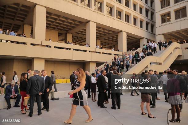 Federal Bureau of Investigation employees return to work following the installation ceremony for FBI Director Christopher Wray at the bureau's...