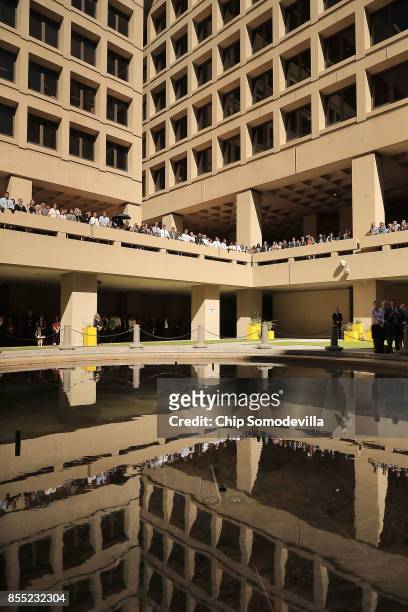 Federal Bureau of Investigation employees and guests attend the installation ceremony for FBI Director Christopher Wray at the bureau's headquaters...