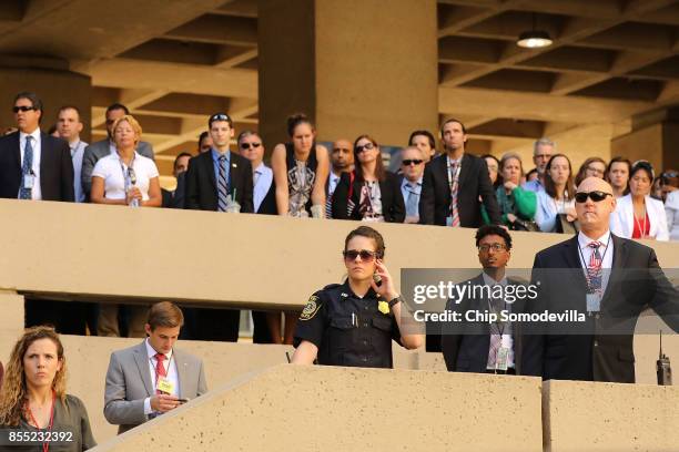 Federal Bureau of Investigation employees and guests attend the installation ceremony for FBI Director Christopher Wray at the bureau's headquaters...