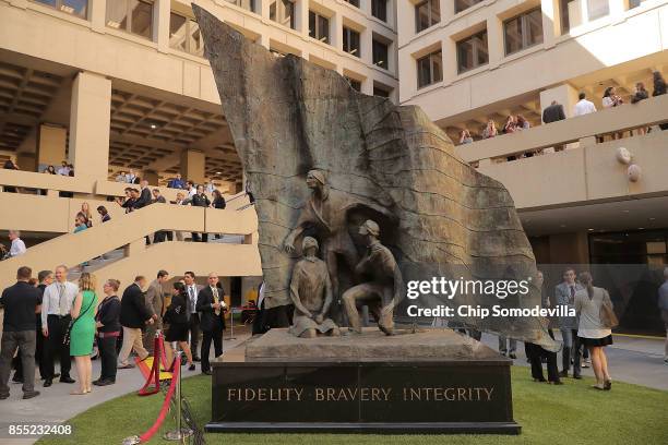 The statue Fidelity, Bravery, Integrity by Frederick Charles Shrady stands in the middle of the courtyard at the Federal Bureau of Investigation's J....