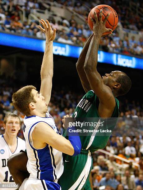 Greg Paulus of the Duke Blue Devils defends against Malik Alvin of the Binghamton Bearcats during the first round of the NCAA Division I Men's...