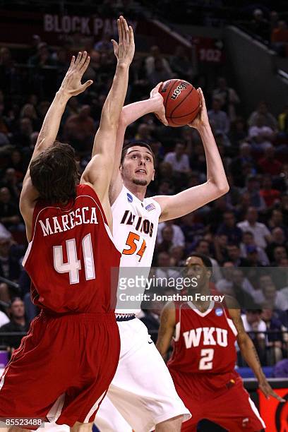 Mike Tisdale of the Illinois Fighting Illini goes up for a shot over Matt Maresca of the Western Kentucky Hilltoppers in the first half during the...